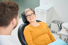 smiling woman after teeth whitening treatment