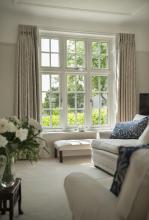 Custom wooden shutters on a London window
