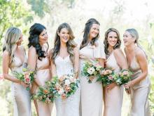 6 women worn wedding dress and holding buke in their hand is standing together.