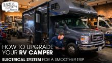A Technician Repairing An RV Camper inside A Workshop