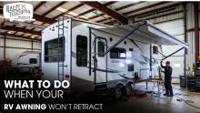 A 5th Wheel RV inside a Workshop for Awning Repair Works