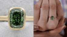 Rectangular green diamond ring with a bezel setting in yellow gold, featuring a deep green center stone surrounded by a lighter green diamond halo, shown in a close-up view and worn on a finger.