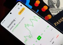 smartphone-displaying-investment-growth-app-interface