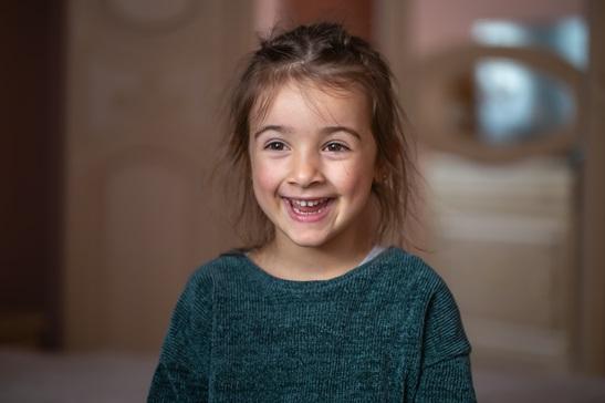 close-up-portrait-of-a-little-girl-in-her-room