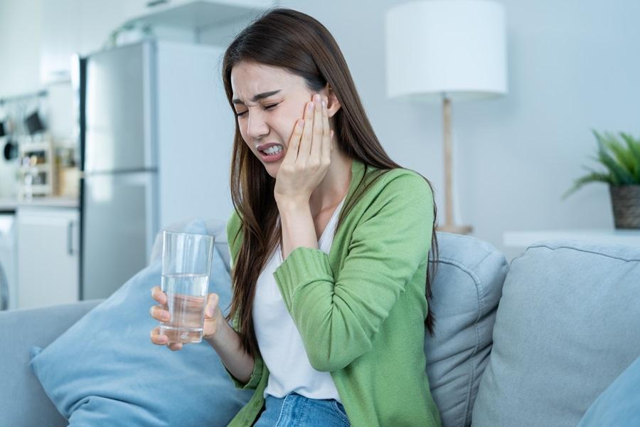 girl suffering from intense jaw pain
