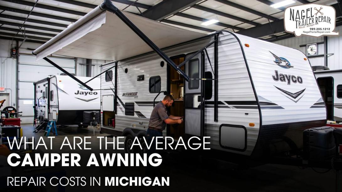 A Technician Checking A Jayco Camper's Awning inside A Workshop